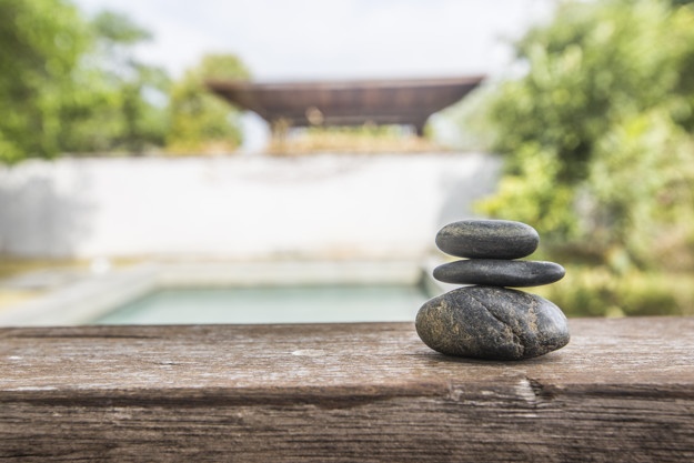 Stones balanced referring to wellness